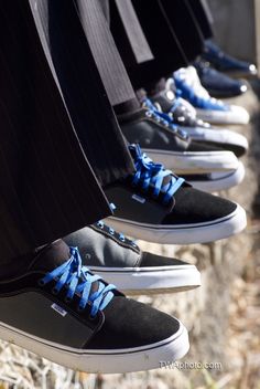 Groom and groomsmen with vans shoes and blue laces.