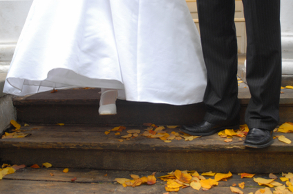 Bride and grooms feet walking down stairs.