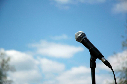 Microphone with blue sky in the background.