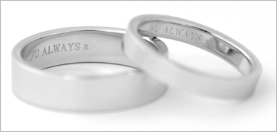 Engraved bride and groom wedding bands.